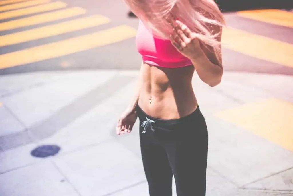 Woman with toned stomach after LA-EMS Body Sculpting Treatment Edmonton